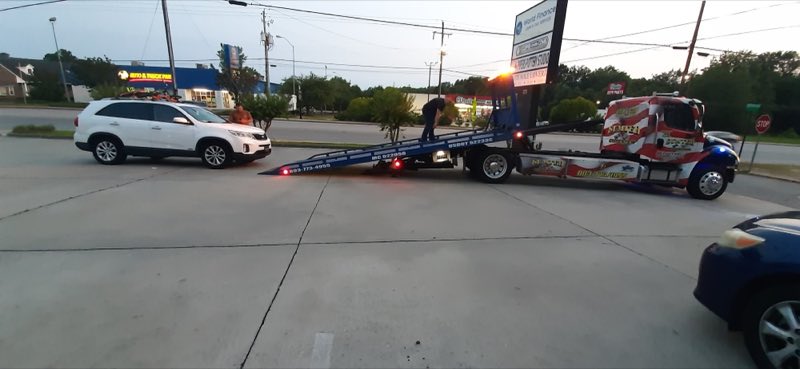 Sumter Wrecker Service loading a vehicle